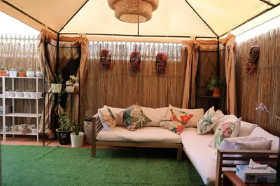 a living room with a couch in a tent at Nice Place in Dubai