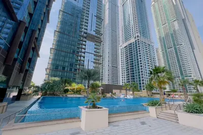 a swimming pool in a city with tall buildings at GuestReady - Marina Gate Studio Suite in Dubai