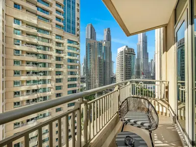 a balcony with a bench and a view of the city at Stylish 1BR - Burj Khalifa View in Dubai