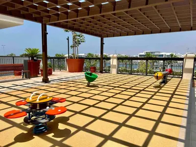 a patio with chairs and tables on a roof at 50 Shades of Grey Luxury Apartment near Beach in Dubai