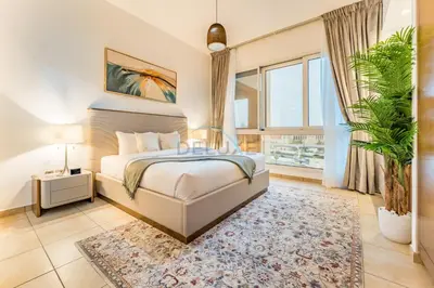 a bedroom with a bed and a large window at Glance at the Royal Atlantis Right by Dubai Top Spots 2BR, Marina Apartments 3, Palm Jumeirah by Deluxe Holiday Homes in Dubai