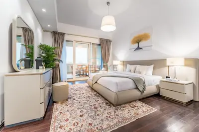 a bedroom with a large bed and a mirror at Glance at the Royal Atlantis Right by Dubai Top Spots 2BR, Marina Apartments 3, Palm Jumeirah by Deluxe Holiday Homes in Dubai