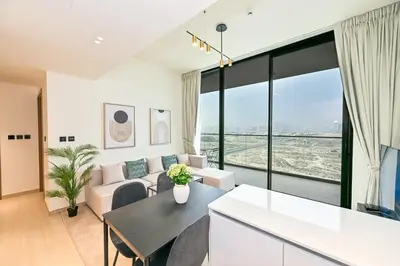 a living room with a couch and a table at Stunning 1 Bdr luxury residence at JVC in Dubai
