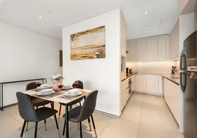 a kitchen and dining room with a table and chairs at Address Residences Stay in Dubai
