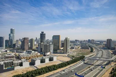 an aerial view of a city with a highway at Hotel Local Dubai, Jumeirah Village Triangle, Autograph Collection in Dubai