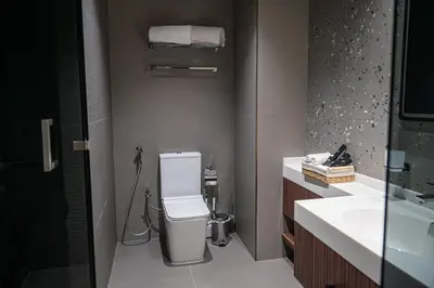 a bathroom with a toilet and a sink at MBL Royal Luxury 1BR on High Floor in Dubai