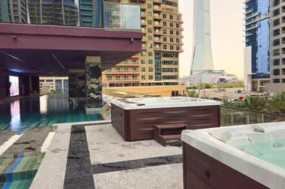 a bathroom with a bath tub on the roof of a building at MBL Royal Luxury 1BR on High Floor in Dubai
