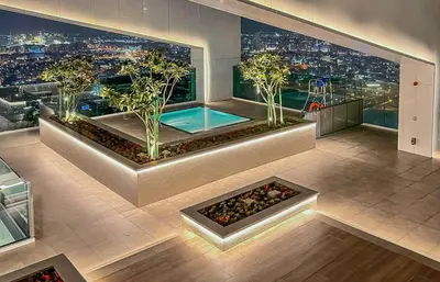 a room with a view of a city at night at Luxury 1 Bed in the heart of the city! Free WiFi in Dubai
