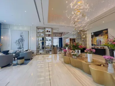 a large lobby with a store with tables and chairs at Exclusive 1BR with Iconic Views in Paramount Tower in Dubai