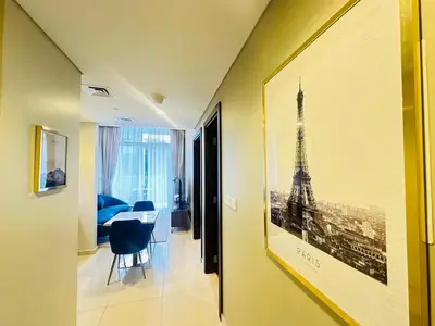 a hallway with a picture of the eiffel tower at AWS Holiday Homes - Top Retreat near the Burj in Dubai
