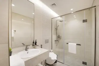 a bathroom with a sink and a shower at EasyGo- Luxury 1BR with Burj Khalifa view and lavish Amenities in Dubai