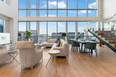 a living room with a couch and chairs and a table at FAM Living -Duplex 4Bed and Maids in Dubai