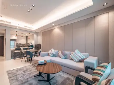 a living room with a couch and a table at Modern 1-Bed Apartment in a Prime Central Location in Dubai