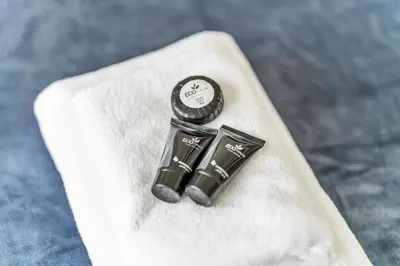 two black objects sitting on top of a white napkin at Exceptional 1BR flat wBalcony Gym & Pool in JVC in Dubai