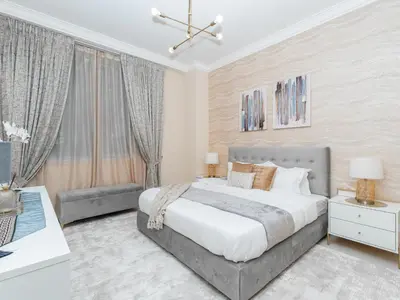 a bedroom with a large bed and a couch at Exclusive 2BR in Al Yass Tower Dubai Marina - Private Terrace & Premium Community, Managed by Think Realty in Dubai