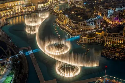 a view of a river with many water fountains at SML Vacation Homes - Sky High Apartments with Burj Khalifa and Dubai Fountain Views at Grande Signature, Downtown Dubai in Dubai