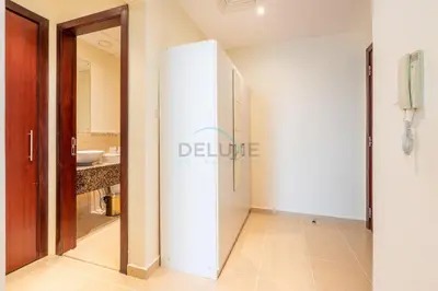 a bathroom with a white refrigerator and a sink at Sea-Facing 1BR with Ain Dubai View Close to Marina Beach, Rimal 3, Jumeirah Beach Residence by Deluxe Holiday Homes in Dubai