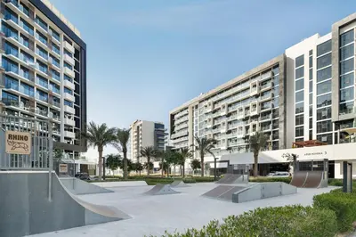a skate park in front of two tall buildings at Modern Meydan Studio Burj View Downtown in Dubai