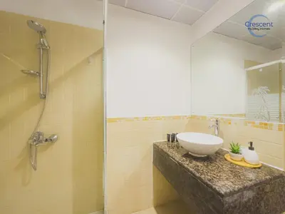 a bathroom with a sink and a shower at Relaxing Beach Escape in JBR in Dubai