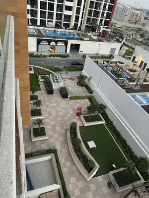an overhead view of a courtyard in a building at Studios Apartment in Azizi Riviera in Dubai