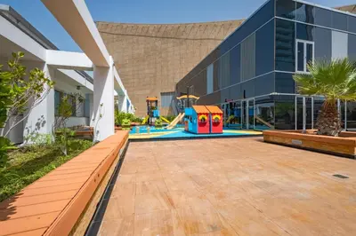 a playground in the courtyard of a building at City-Centered 1BR, Minutes to Metro and Key Attractions, Sky Gardens, DIFC by Deluxe Holiday Homes in Dubai