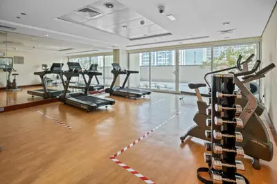 a gym with a bunch of exercise bikes in it at Stylish JLT Studio Lakeview Metro 5min & Marin in Dubai