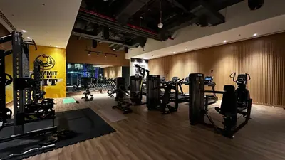 a gym with several treadmills and machines in a room at Palm Jumeirah Beachfront apartment with Amazing Infinity Pool and private beach in Dubai