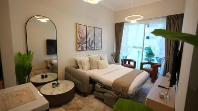 a hotel room with a bed and a large mirror at 1BHK full canal view apartment in Business bay ! in Dubai