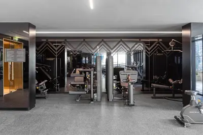 a gym with a bunch of exercise equipment in it at Missoni Luxury Life Suite DPA Direct Pool Access in Dubai