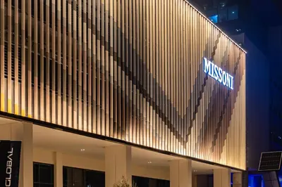 a building with a sign on the side of it at Missoni Luxury Life Suite DPA Direct Pool Access in Dubai