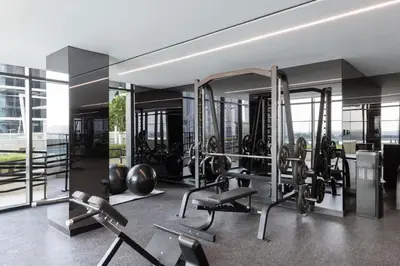 a gym with cardio equipment in a building at Missoni Luxury Life Suite DPA Direct Pool Access in Dubai