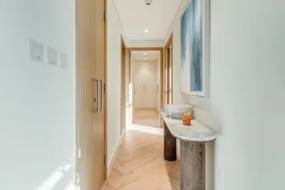 a bathroom with a sink and a toilet in a room at Sleek and Modern Stay in Dubai Hills in Dubai