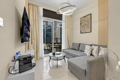 a living room with a couch and a table at City View 1BR Prime Location in Business Bay by Vibel in Dubai