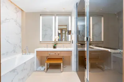 a bathroom with a tub and a sink and a shower at Ultimate Stay Luxurious Address Opera 2BR Next to Burj Khalifa and Dubai Mall Large Balcony with Stunning Views in Dubai