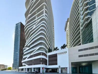 a tall building in front of two tall buildings at Trophy-Lux 1BR Jacuzzi Suite Busbay W Big Balcony in Dubai