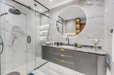 a bathroom with a sink and a mirror at Burj Khalifa & Canal Views at Mayfair Tower in business bay - Luxurious 1BDR Apartment in Dubai