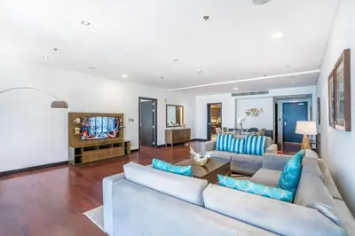 a living room with a couch and a tv at RH -Luxury Living, Full Sea View Apartment on palm in Dubai