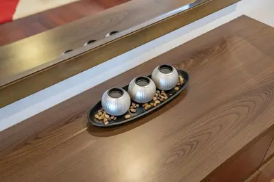 three vases sitting on a plate on a table at RH -Luxury Living, Full Sea View Apartment on palm in Dubai