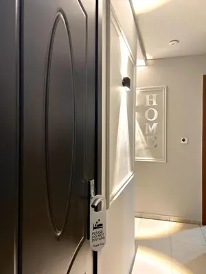 a stainless steel refrigerator in a room at Adaz Homes in Dubai