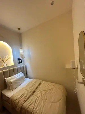 a bedroom with a bed in a room at Adaz Homes in Dubai