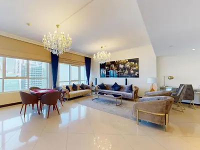 a living room with couches and a dining room at Spacious Duplex 4BR with Maids Room in Dubai