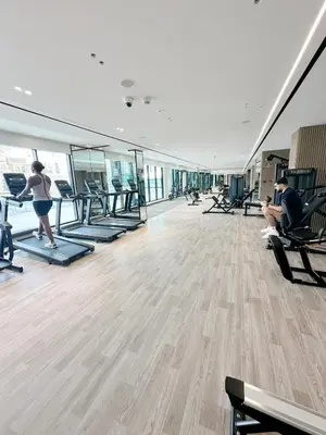 a gym with people exercising on treadmills at Luxury 2 bedroom Unit, Prime Location in Dubai