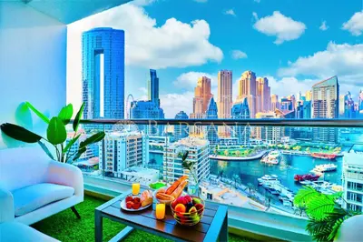 a balcony with a view of a city skyline at Barsana - Seaside Luxury 2BDR - Panoramic Marina & Sea Views in Dubai