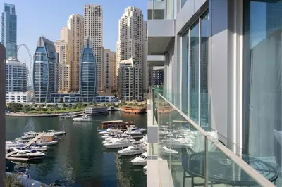 a view of a river with boats in a city at 1 Bedroom Marina with Canal View in Dubai
