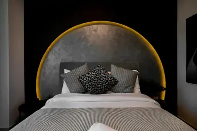 a bed with a head board with pillows on it at Ultimate 5BR Luxury I 2500 sqf I Burj Inner Circle in Dubai