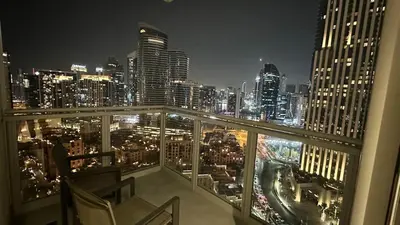 a view of a city at night from a balcony at Ultimate 5BR Luxury I 2500 sqf I Burj Inner Circle in Dubai