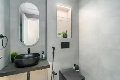 a bathroom with a black sink and a mirror at Ultimate 5BR Luxury I 2500 sqf I Burj Inner Circle in Dubai