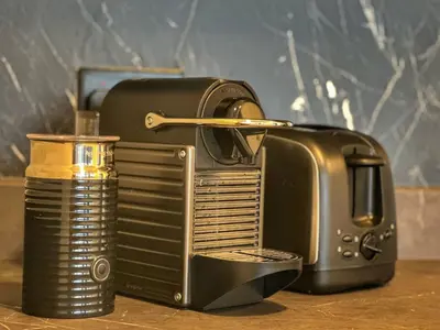 a black and gold toaster sitting on a table at Luxury in the Sky - 1BR Burj Inner Circle in Dubai
