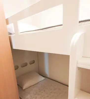 a small room with a bed and a window at Spacious 3BR, Private Beach Access in Dubai