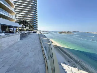 a view of the ocean from a balcony of a building at Grand Bleu - Luxurious One Bedroom with Sea View in Dubai